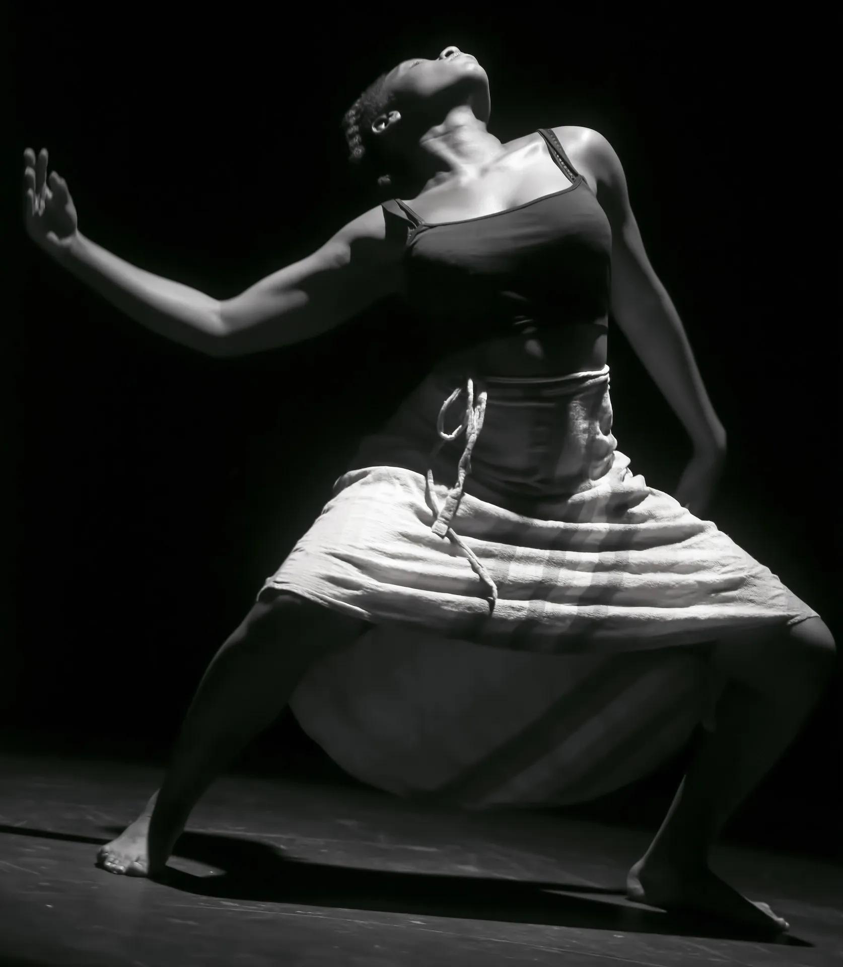 african woman dances expressively